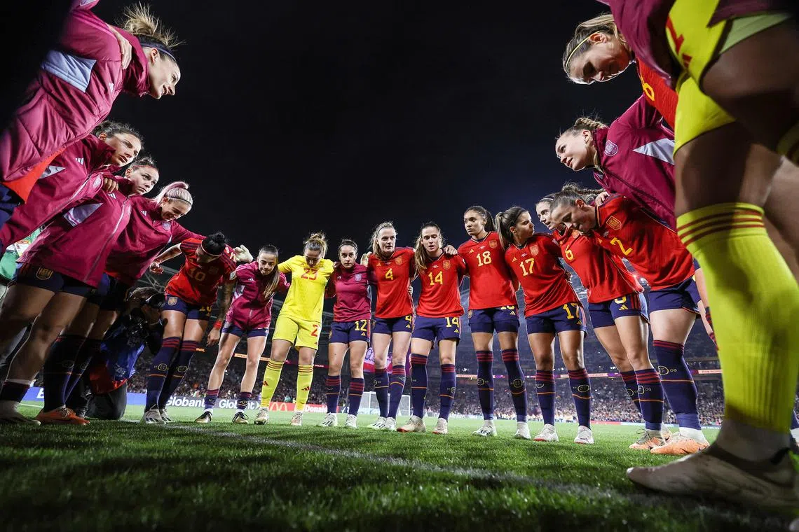 Spain's players standing in a huddle ahead of the Women's World Cup final win over England on Aug 20 at Stadium Australia in Sydney.
