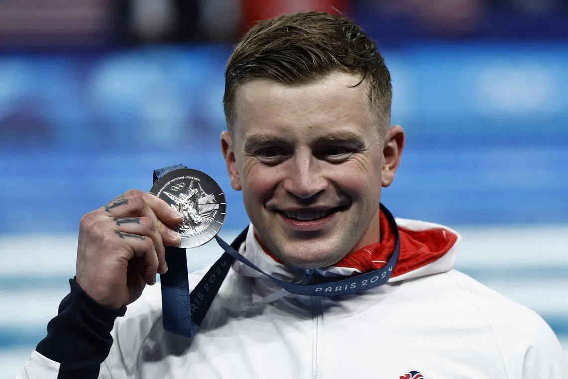 FILE PHOTO: Paris 2024 Olympics - Swimming - Men's 100m Breaststroke Victory Ceremony - Paris La Defense Arena, Nanterre, France - July 28, 2024.  Silver medallist Adam Peaty of Britain celebrates. REUTERS/Clodagh Kilcoyne/File Photo