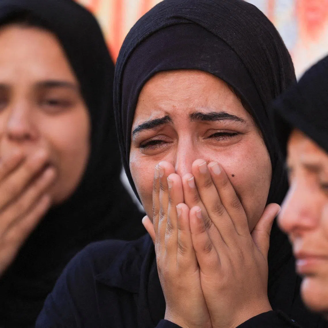 Women mourn during the funeral of Palestinians, who were killed in an Israeli strike, according to medics, at Al-Shifa Hospital in Gaza City, April 23, 2026. REUTERS/Dawoud Abu Alkas