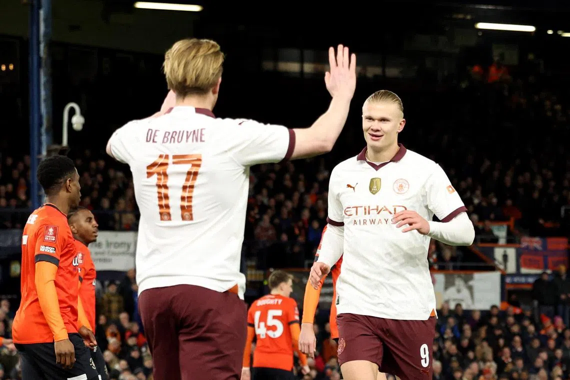 Manchester City's Erling Haaland celebrates with Kevin de Bruyne after scoring the first of his five goals in the 6-2 FA Cup win over Luton Town.