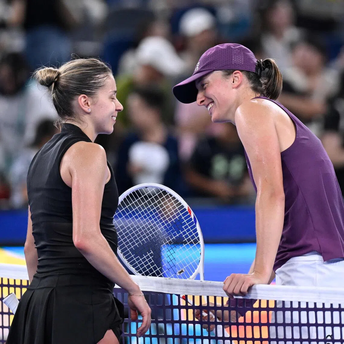 Poland’s Iga Swiatek (right) with compatriot Maja Chwalinska at the Wuhan Open on Oct 17.