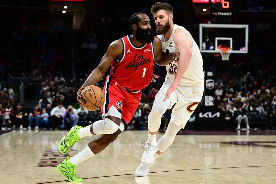 Los Angeles Clippers guard James Harden drives to the basket against Cleveland Cavaliers forward Dean Wade during the second half at Rocket Arena.