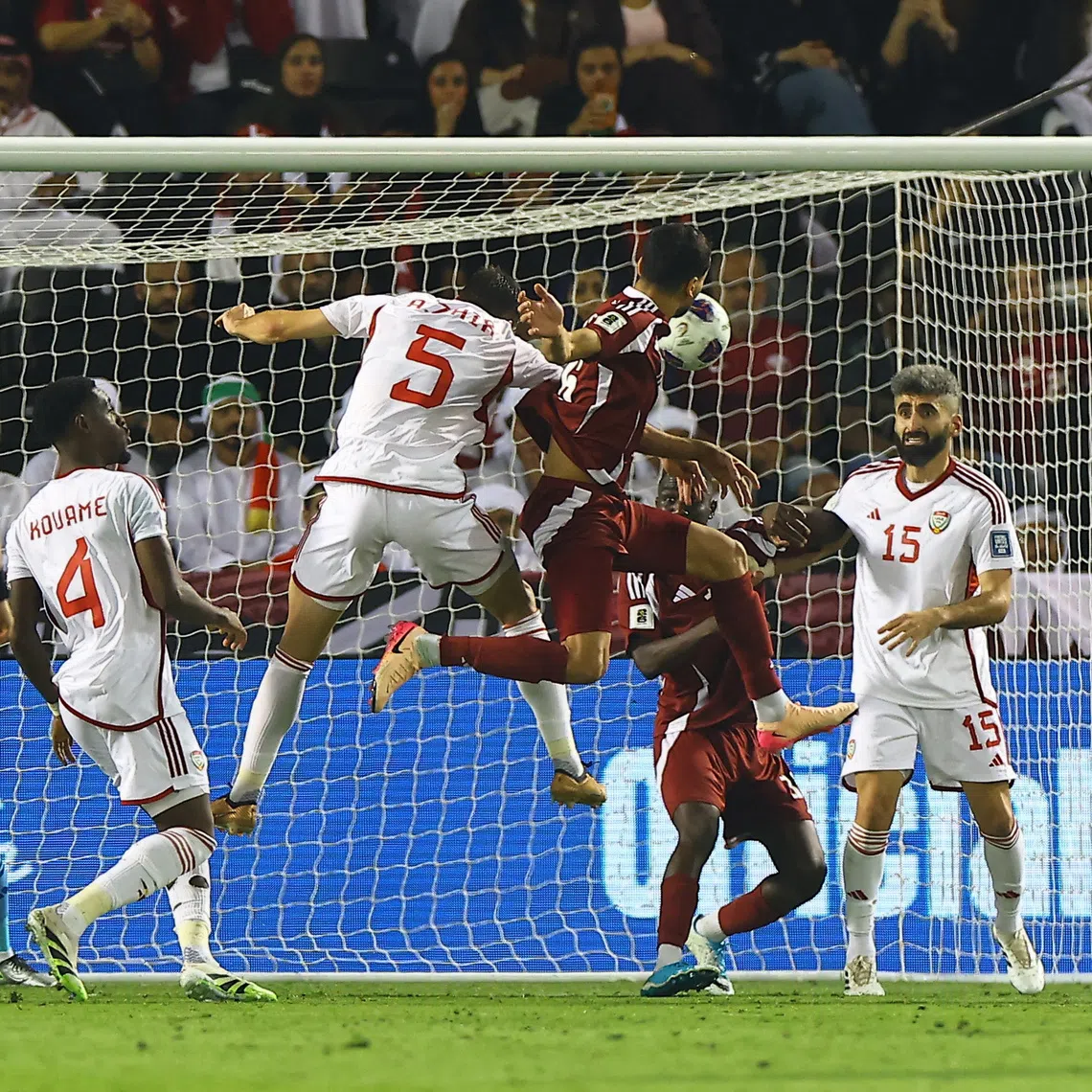 Soccer Football - FIFA World Cup - AFC Qualifiers - Group A - Qatar v United Arab Emirates - Jassim Bin Hamad Stadium, Doha, Qatar - October 14, 2025 Qatar's Boualem Khoukhi scores their first goal REUTERS/Ibraheem Al Omari