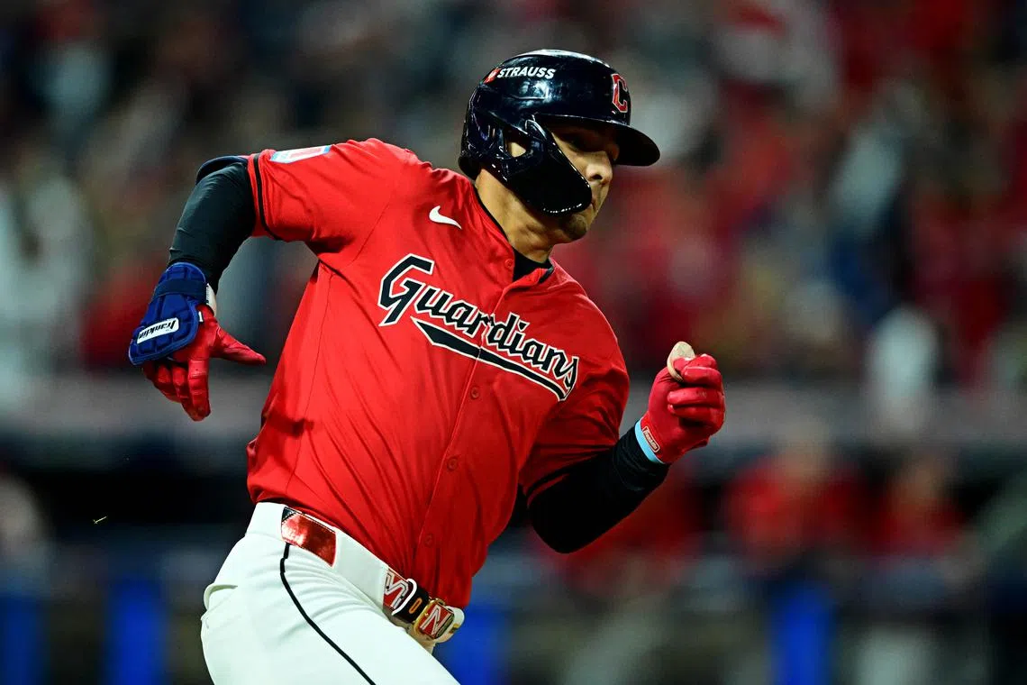 FILE PHOTO: Oct 19, 2024; Cleveland, Ohio, USA; Cleveland Guardians second base Andrés Giménez (0) hits a double during the fifth inning against the New York Yankees during game five of the ALCS for the 2024 MLB playoffs at Progressive Field. Mandatory Credit: David Dermer-Imagn Images/File Photo