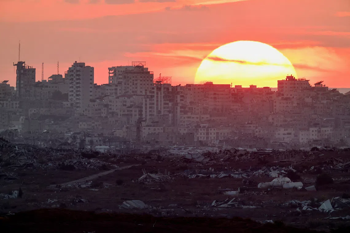 The sun sets over Gaza, as seen from the Israeli side of the border, September 23, 2026. REUTERS/Amir Cohen