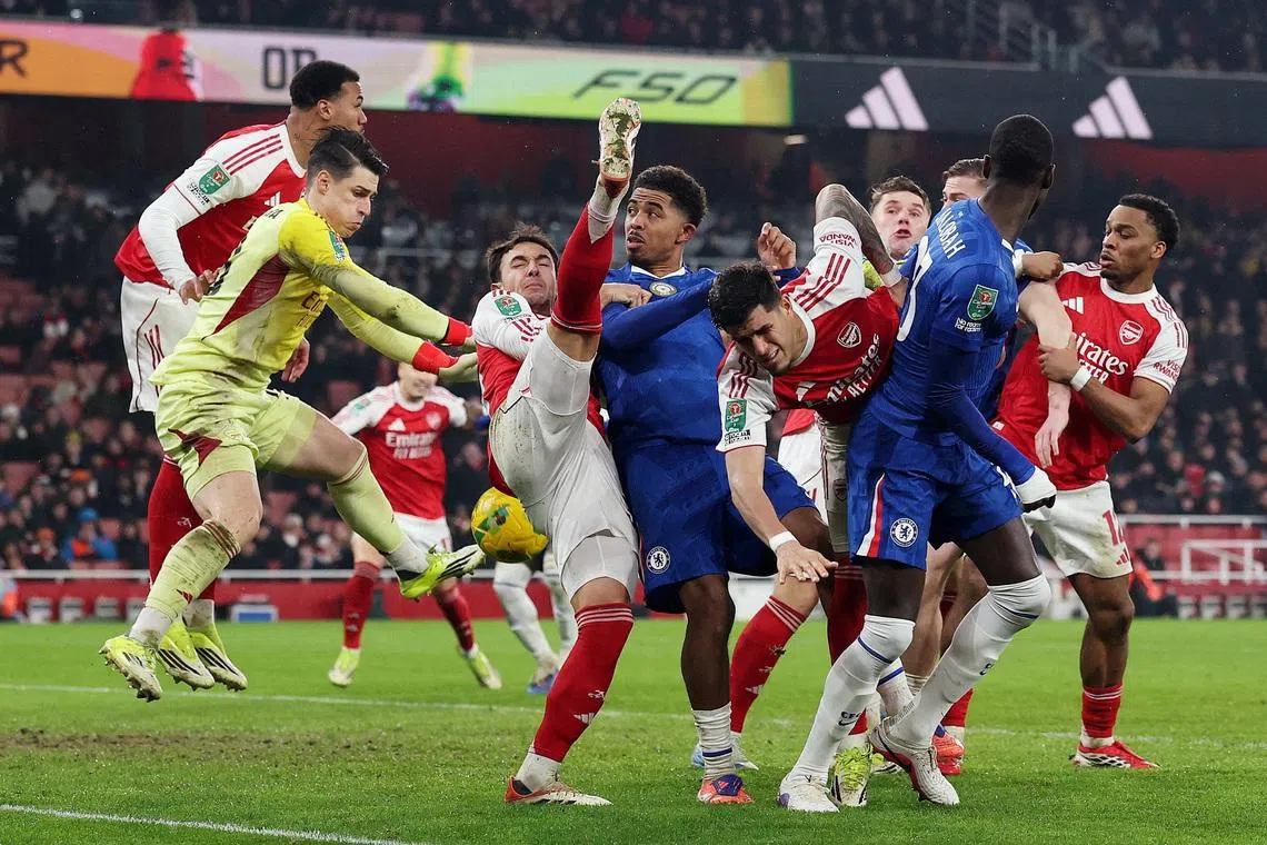 Soccer Football - Carabao Cup - Semi Final - Second Leg - Arsenal v Chelsea - Emirates Stadium, London, Britain - February 3, 2026 Chelsea's Trevoh Chalobah and Wesley Fofana in action with Arsenal's Piero Hincapie, Martin Zubimendi and Kepa Arrizabalaga Action Images via Reuters/Paul Childs