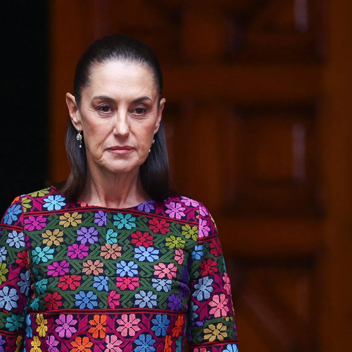 Mexican President Claudia Sheinbaum walks to receive Swiss Federal President Guy Parmelin at the National Palace in Mexico City, Mexico, July 8, 2026. REUTERS/Daniel Becerril