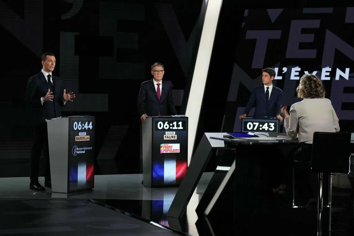 Far-right National Rally leader Jordan Bardella (left) speaking at a televised debate, next to Socialist leader Olivier Faure (centre) and French Prime Minister Gabriel Attal.