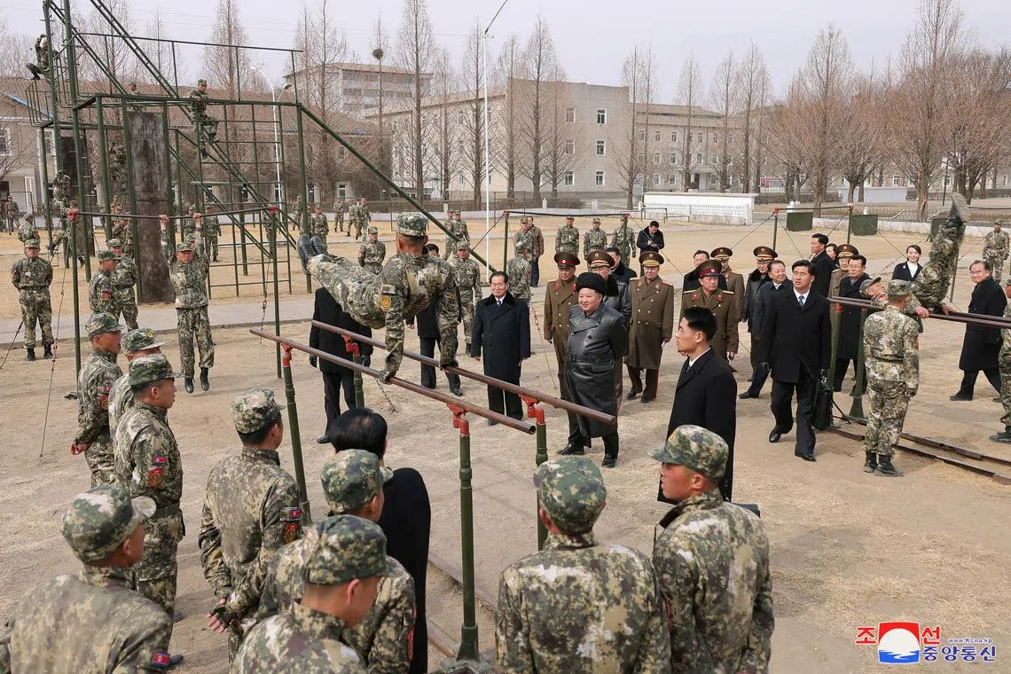 FILE PHOTO: North Korean leader Kim Jong Un watches a cadet practicing on the parallel bars during his visit to the Kang Kon Military Academy, in Pyongyang,  North Korea, February 25, 2025, in this picture released by the Korean Central News Agency. KCNA via REUTERS/File Photo