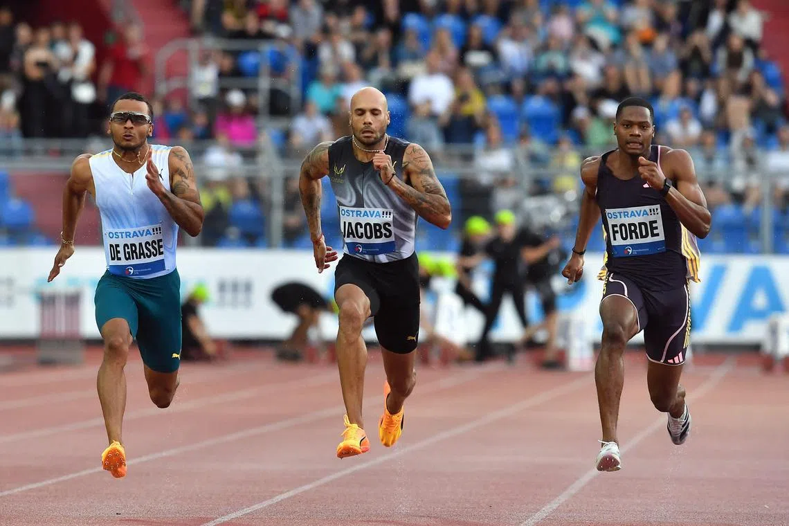 Italy's Marcell Jacobs, Canada’s Andre De Grasse and Jamaica's Ryiem Forde compete in the 100m in the Golden Spike meet in Ostrava, Czech Republic on May 28, 2024.