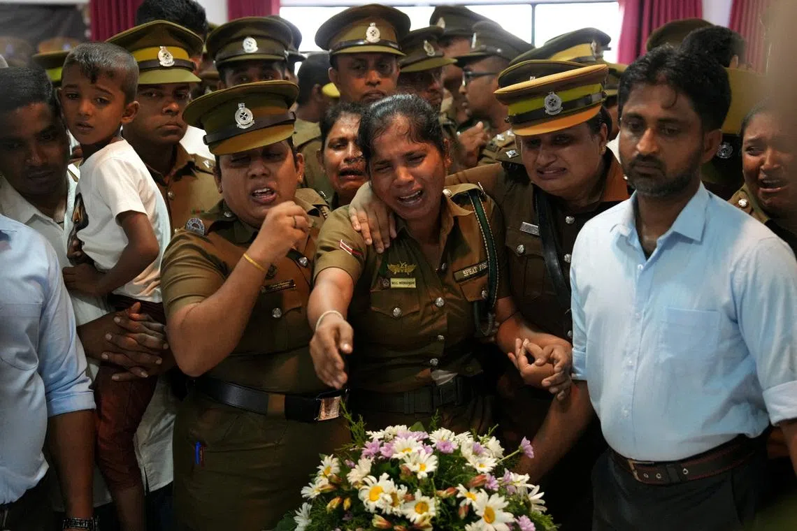 The seven prison officials and 19 prisoners died in two days of fighting between two groups of inmates at the prison in the coastal town of Negombo.