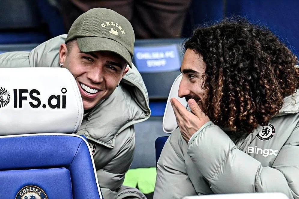 Chelsea's Enzo Fernandez (left) in the stands with teammate Marc Cucurella after he was banned for two matches by manager Liam Rosenior. Fernandez had hinted he was willing to leave Stamford Bridge at the end of the season.