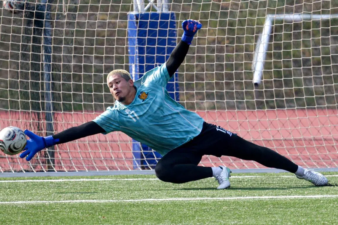 Hougang United’s new shot-stopper Takahiro Koga making a save during a training session at Bedok Stadium on Sep 3.