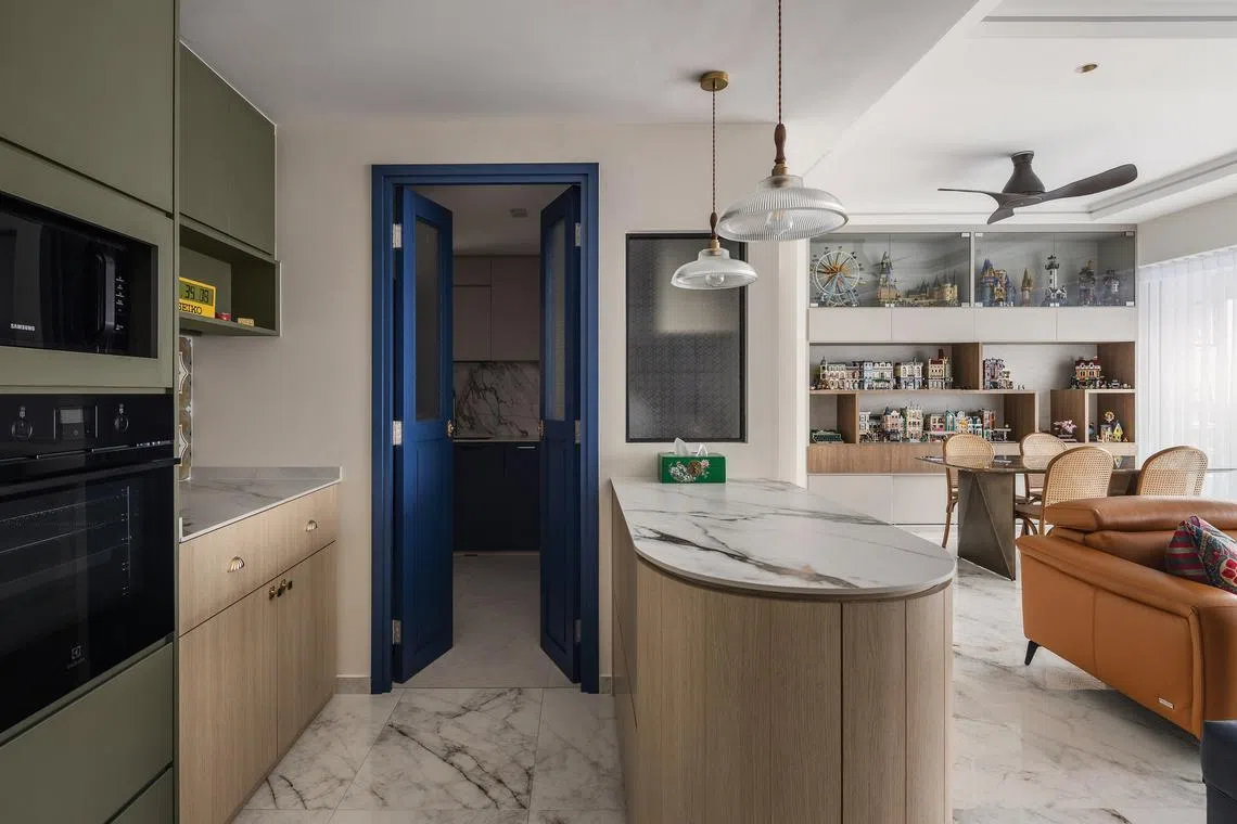 This apartment in Pasir Ris is decorated with bold blues, Lego sets and plenty of travel souvenirs.