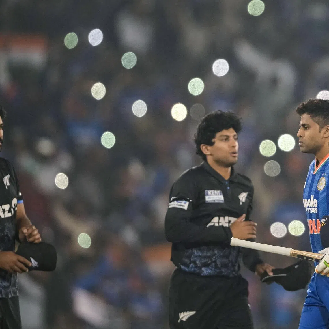 India's captain Suryakumar Yadav shakes hands with New Zealand's Rachin Ravindra as Ish Sodhi awaits his turn at the end of the second Twenty20 international at the Shaheed Veer Narayan Singh International Cricket Stadium in Raipur on Jan 23, 2026.