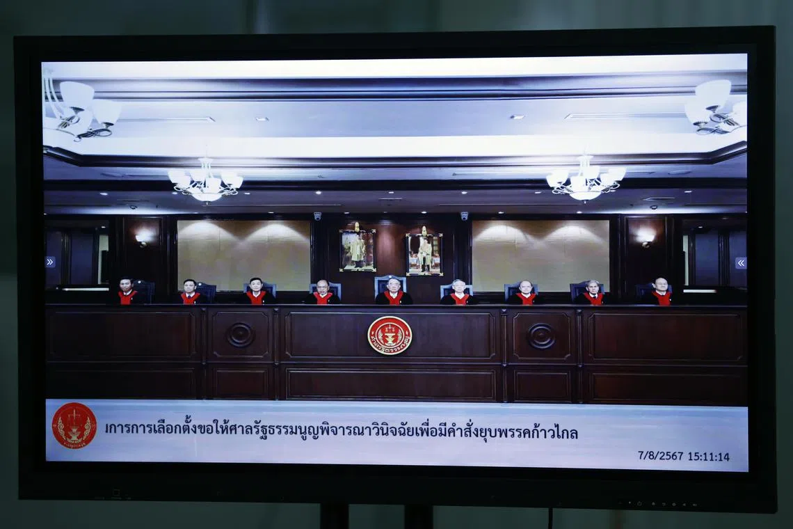 Judges are seen ordering the disbanding of the Move Forward Party at the Constitutional Court in a television screengrab on Aug 7.