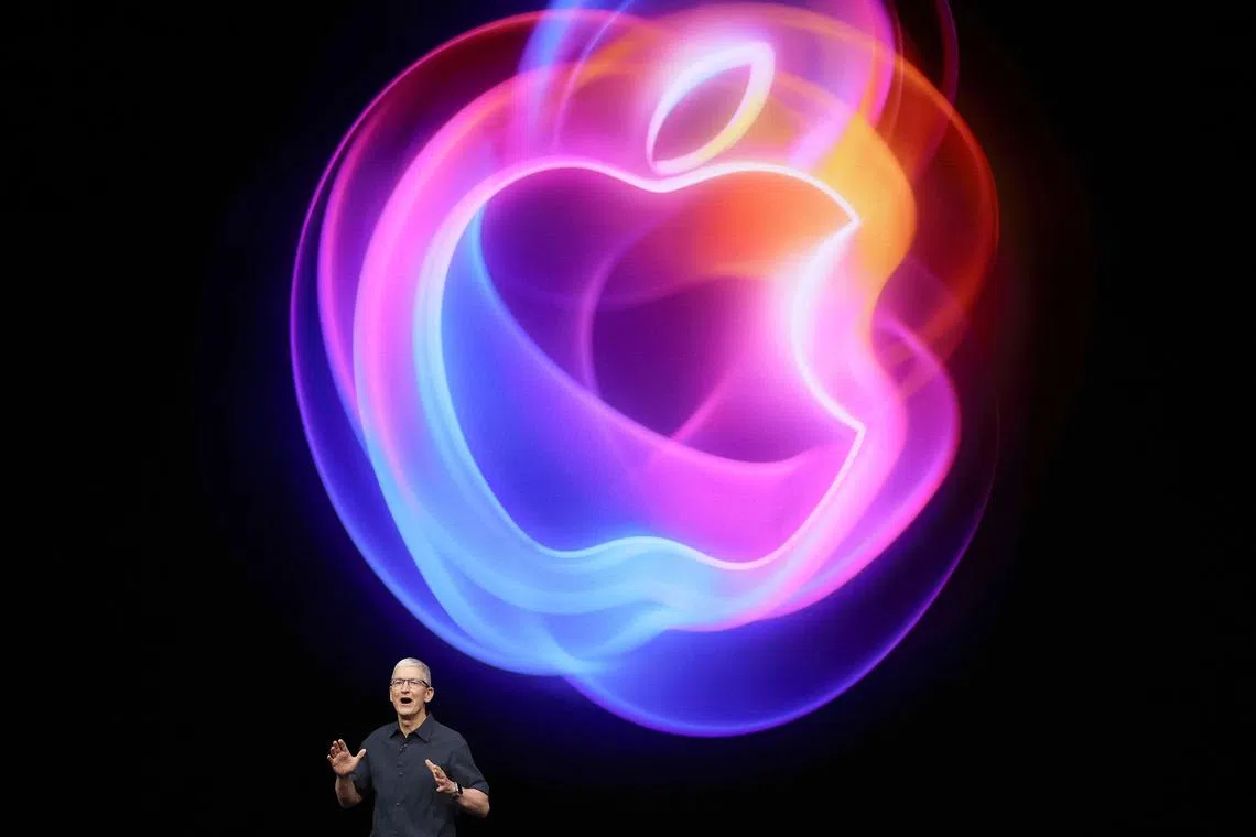 Apple CEO Tim Cook delivers remarks before the start of an Apple event at the Apple headquarters on Sept 9.