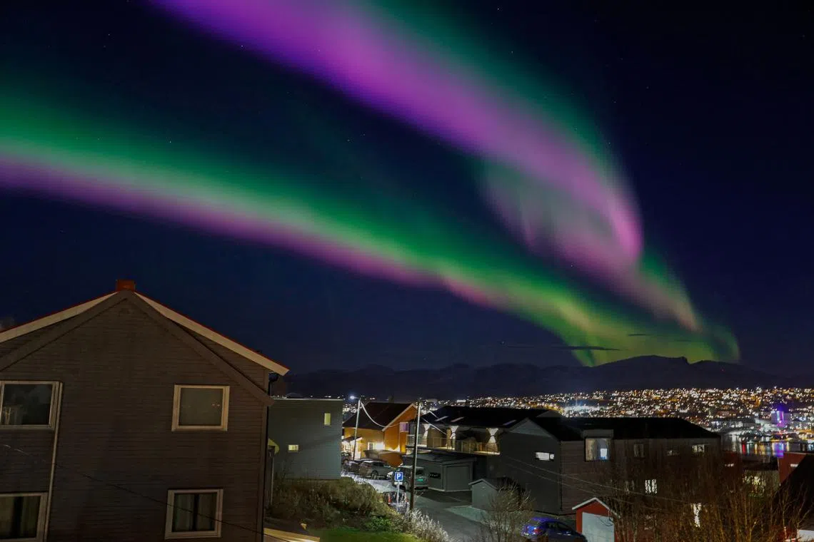 Northern lights are seen over Tromsoe on November 2, 2022. 