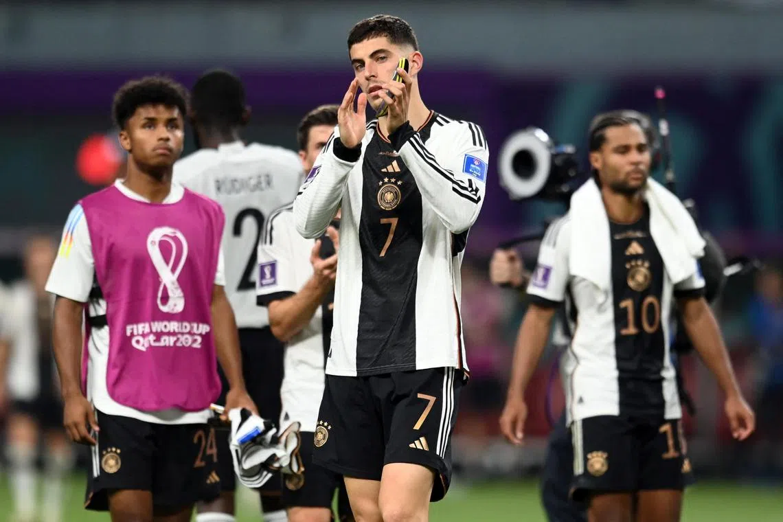 Germany's Kai Havertz looks dejected as he applauds fans after the match against Japan.