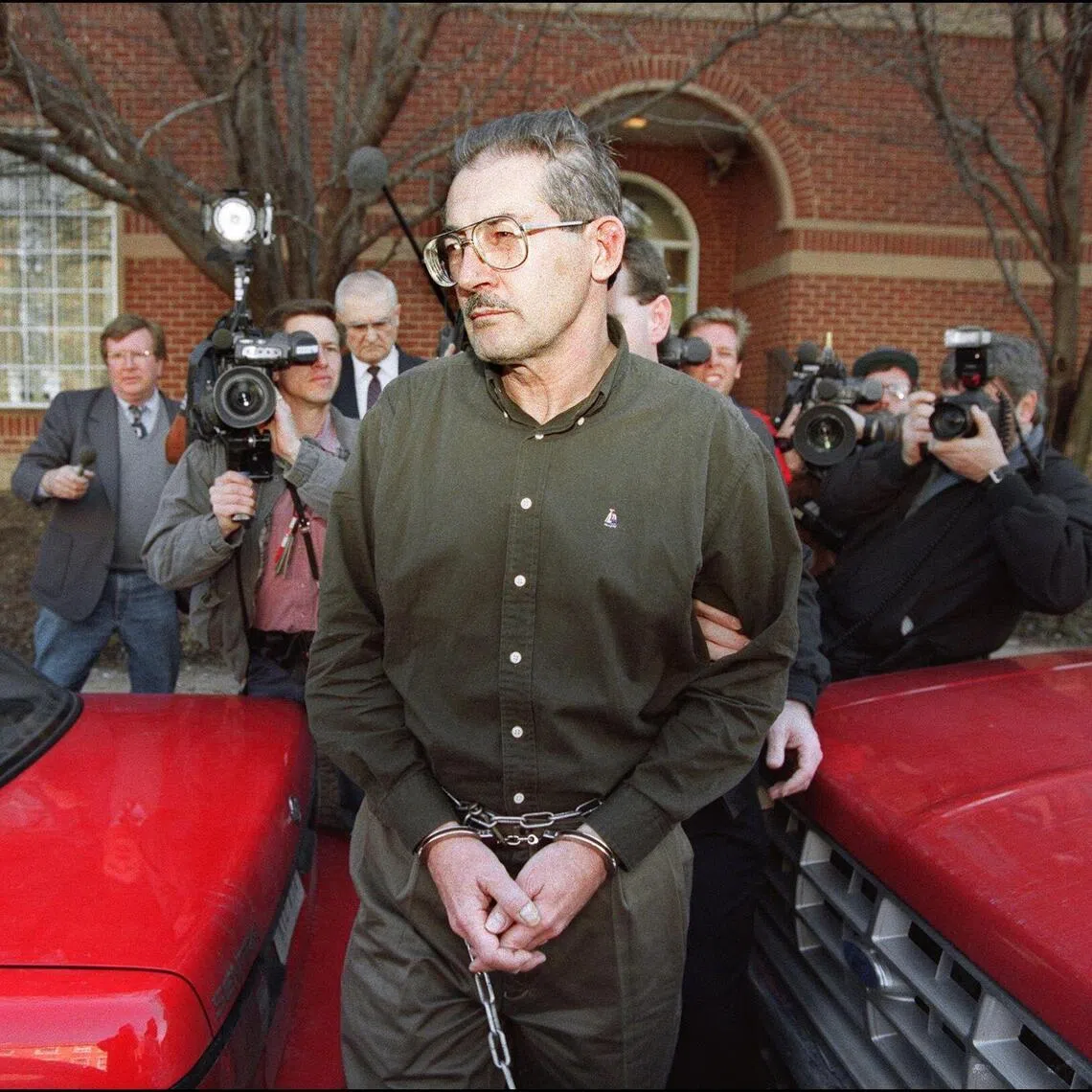 Former senior Central Intelligence Agency office Aldrich Hazen Ames is led from US Federal Courthouse in Alexandria, 22 February 1994, after being arraigned on charges of spying for the former Soviet Union. Aldrich Ames, the Central Intelligence Agency spy who was sentenced to life in prison for selling secrets to Moscow, costing the lives of a dozen double agents, died January 5 in custody, US authorities said.
He was 84, according to the Bureau of Prisons. (Photo by LUKE FRAZZA / AFP)