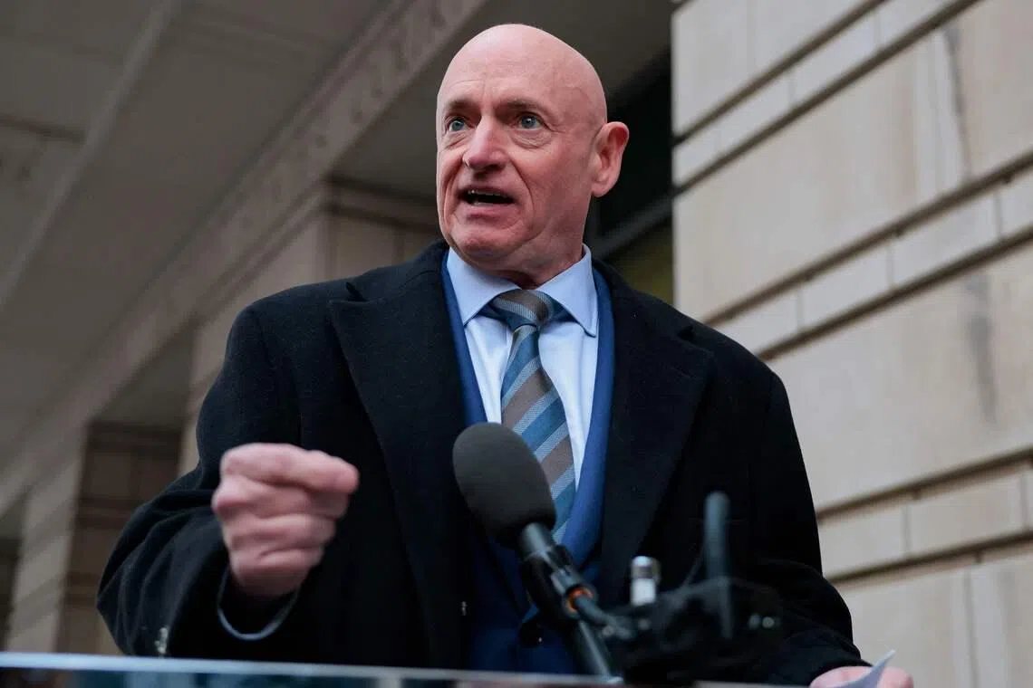 Senator Mark Kelly speaks after departing federal court on Feb 3.