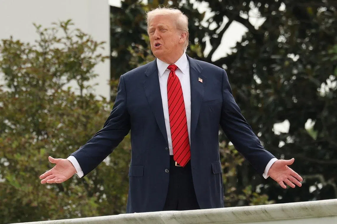 U.S. President Donald Trump shouts to reporters as he walks on the roof of the White House in Washington, D.C., U.S., August 5, 2025. REUTERS/Jonathan Ernst