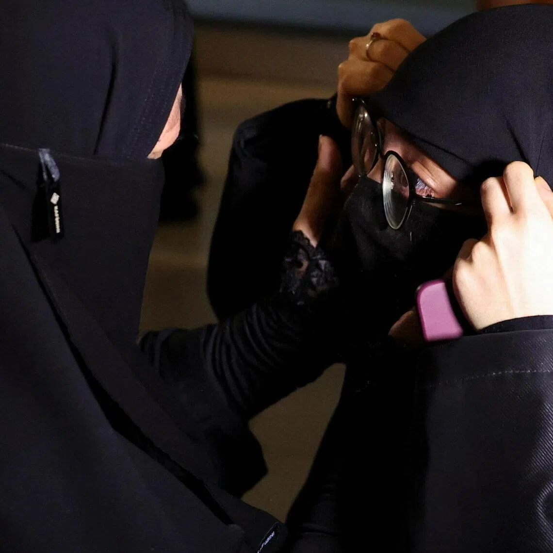 A mother and daughter reunite after the first batch of Indonesians evacuated from Iran arrives at Soekarno Hatta International Airport in Jakarta on March 10.