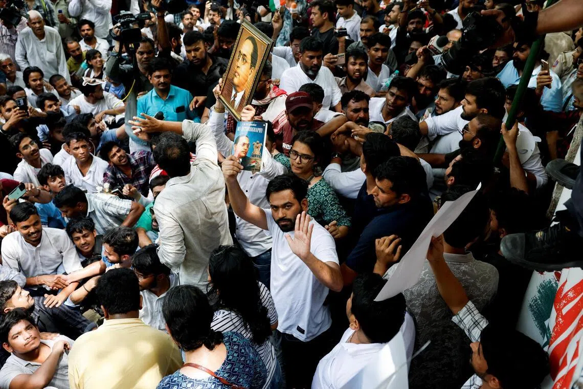 Abhijeet Dipke, head of the Cockroach Janta Party (CJP), joins supporters of the CJP during a sit-in protest demanding the resignation of Indian Education Minister Dharmendra Pradhan, in New Delhi on June 6, 2026.