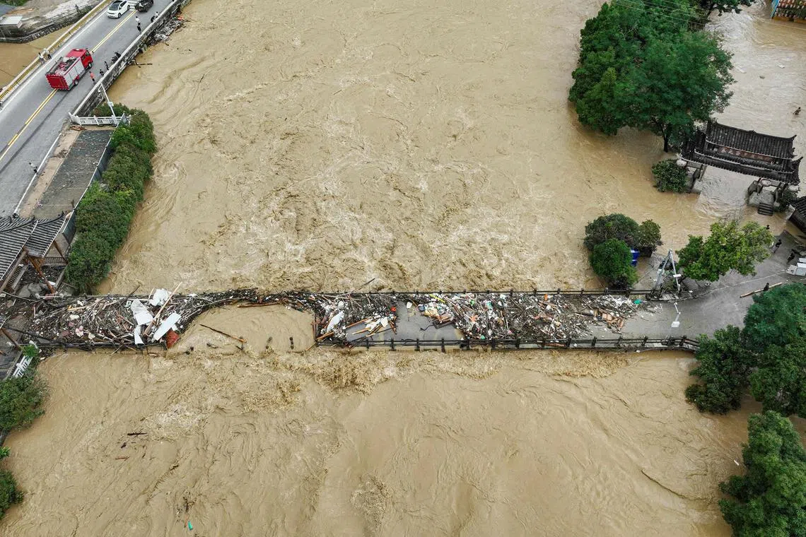 An aerial view of a damaged bridge at a flood-affected village in south-western China's Guizhou province.