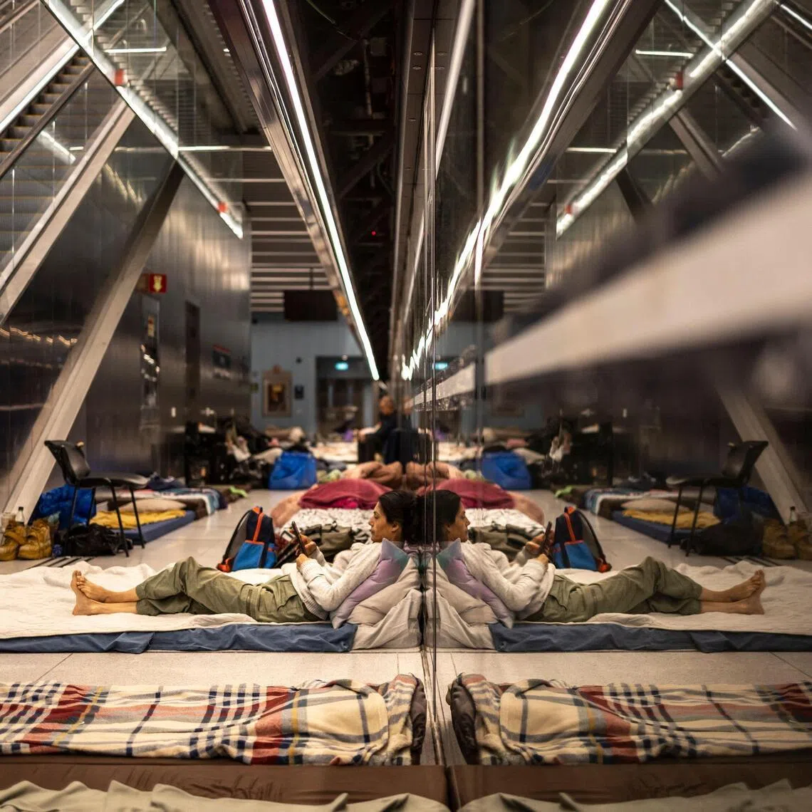 Israeli citizens in a railway station being used as a bomb shelter in Tel Aviv on March 10.