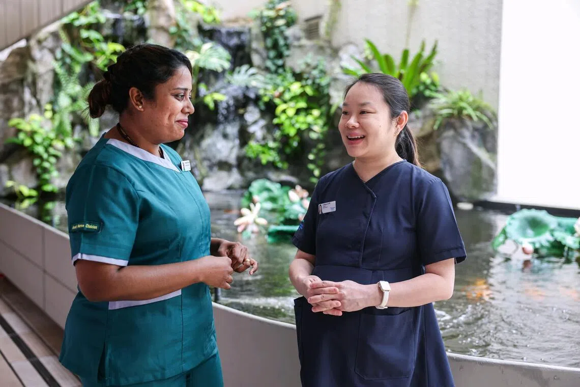 Sharen Lim (right) is the Woodlands Hospital’s geriatric medicine consultant driving the THRIVE programme, where she partners staff from Ren Ci @ Woodlands nursing home, including assistant nurse clinician Anushiya Rajendran, to provide specialist geriatric care for the nursing home residents.