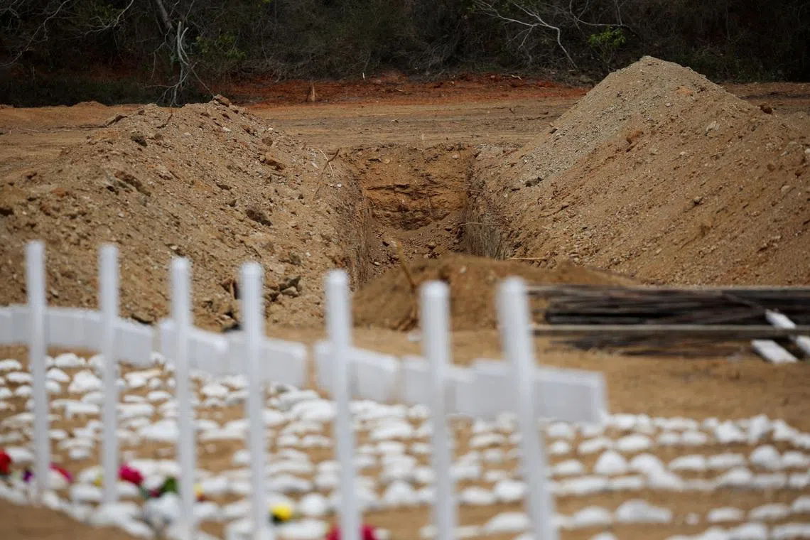 Freshly dug up graves on the day of the burial of earthquake victims at La Esperanza Cemetery, in La Guaira, Venezuela, on July 6.