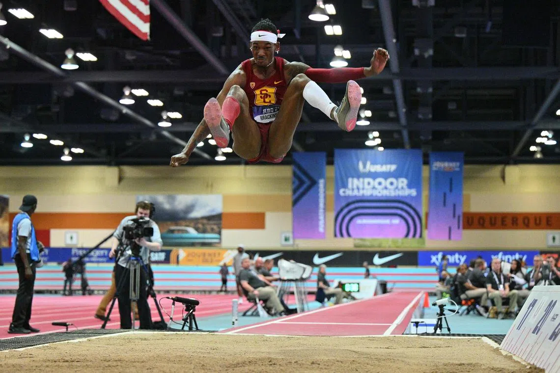 Johnny Brackins competes in the long jump during the 2024 USATF Indoor Championships.