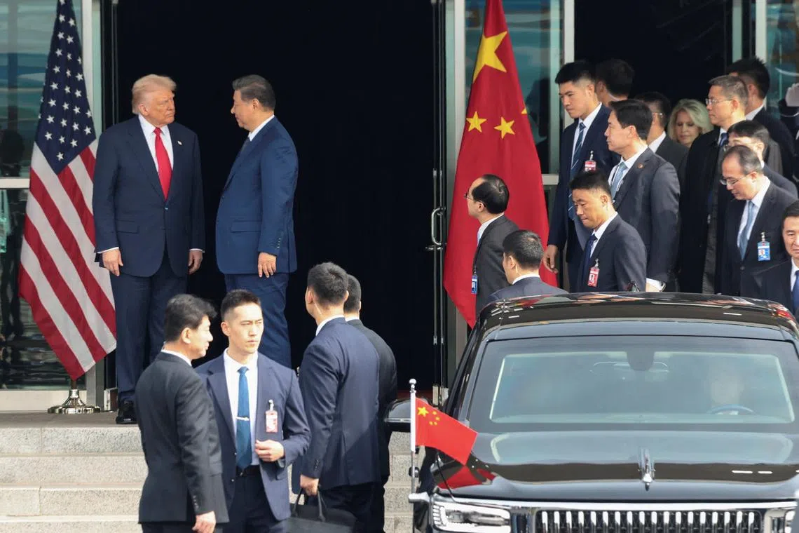U.S. President Donald Trump and Chinese President Xi Jinping talk as they leave after a bilateral meeting at Gimhae International Airport, on the sidelines of the Asia-Pacific Economic Cooperation (APEC) summit, in Busan, South Korea, October 30, 2025. REUTERS/Evelyn Hockstein