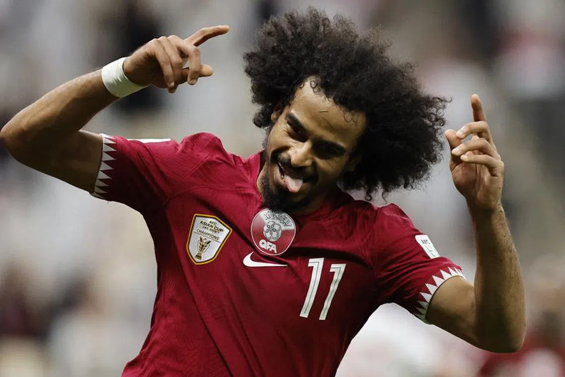 Soccer Football - AFC Asian Cup - Group A - Qatar v Lebanon - Lusail Stadium, Lusail, Qatar - January 12, 2024 Qatar's Akram Afif celebrates scoring their third goal REUTERS/Thaier Al-Sudani
