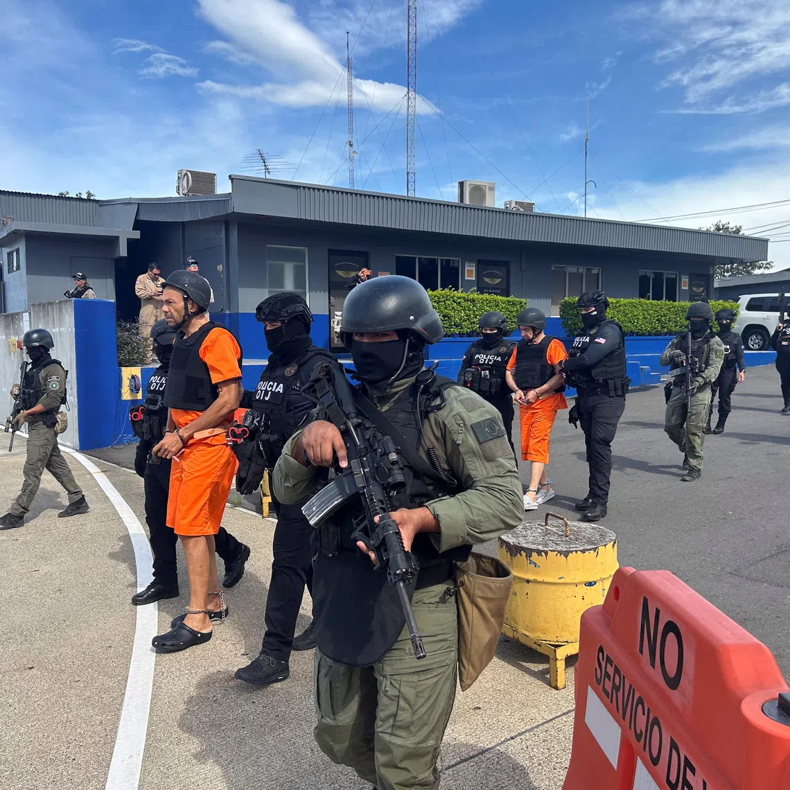 Costa Rican security forces escort alleged drug traffickers Gabriel Lozano, known as \"Compadre,\" and Gilbert Bell Fernandez, known as \"Macho Coca,\" before they are extradited to the United States to stand trial on drug trafficking charges, at Juan Santamaria International Airport in Alajuela, Costa Rica, August 13, 2026. Ministerio de Seguridad Publica/Handout via REUTERS