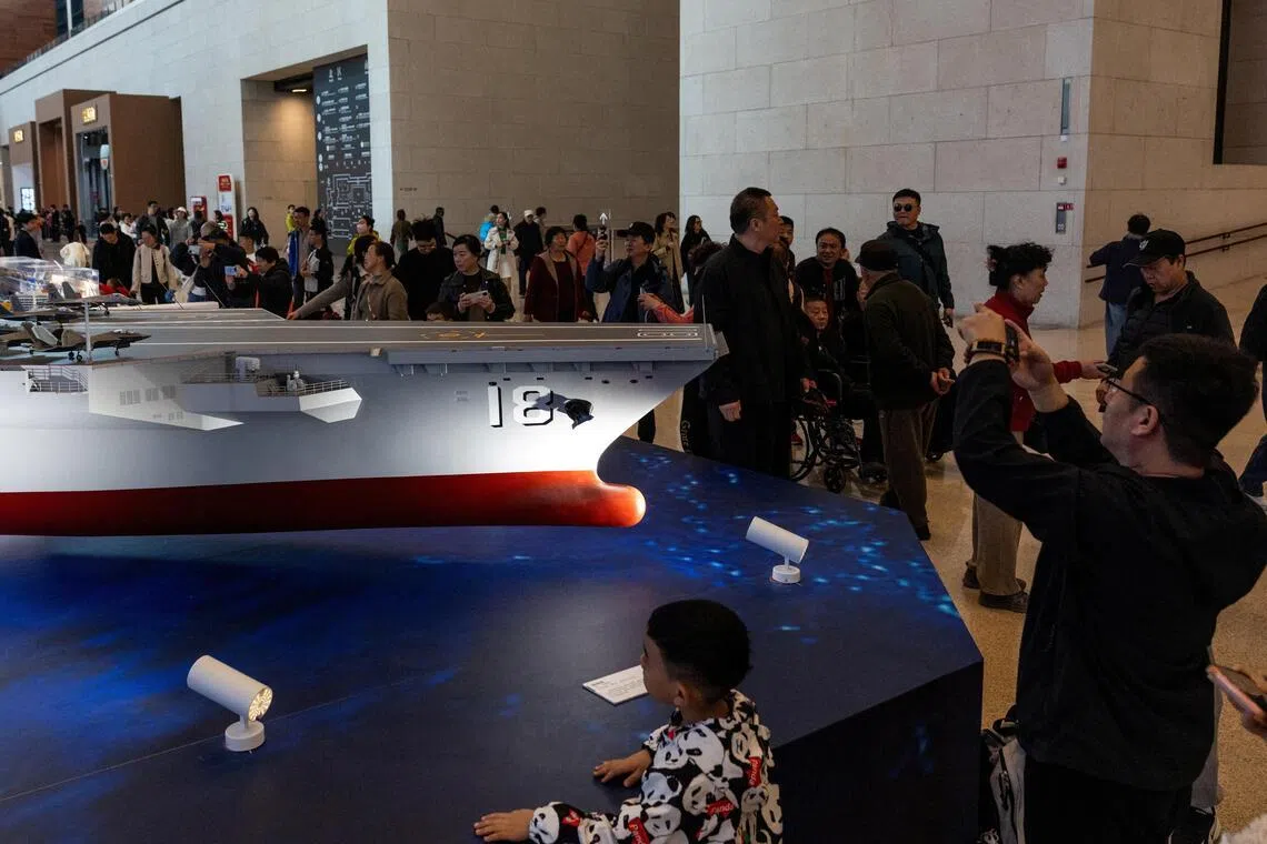 China teases new aircraft carrier in video, vows to build up islands