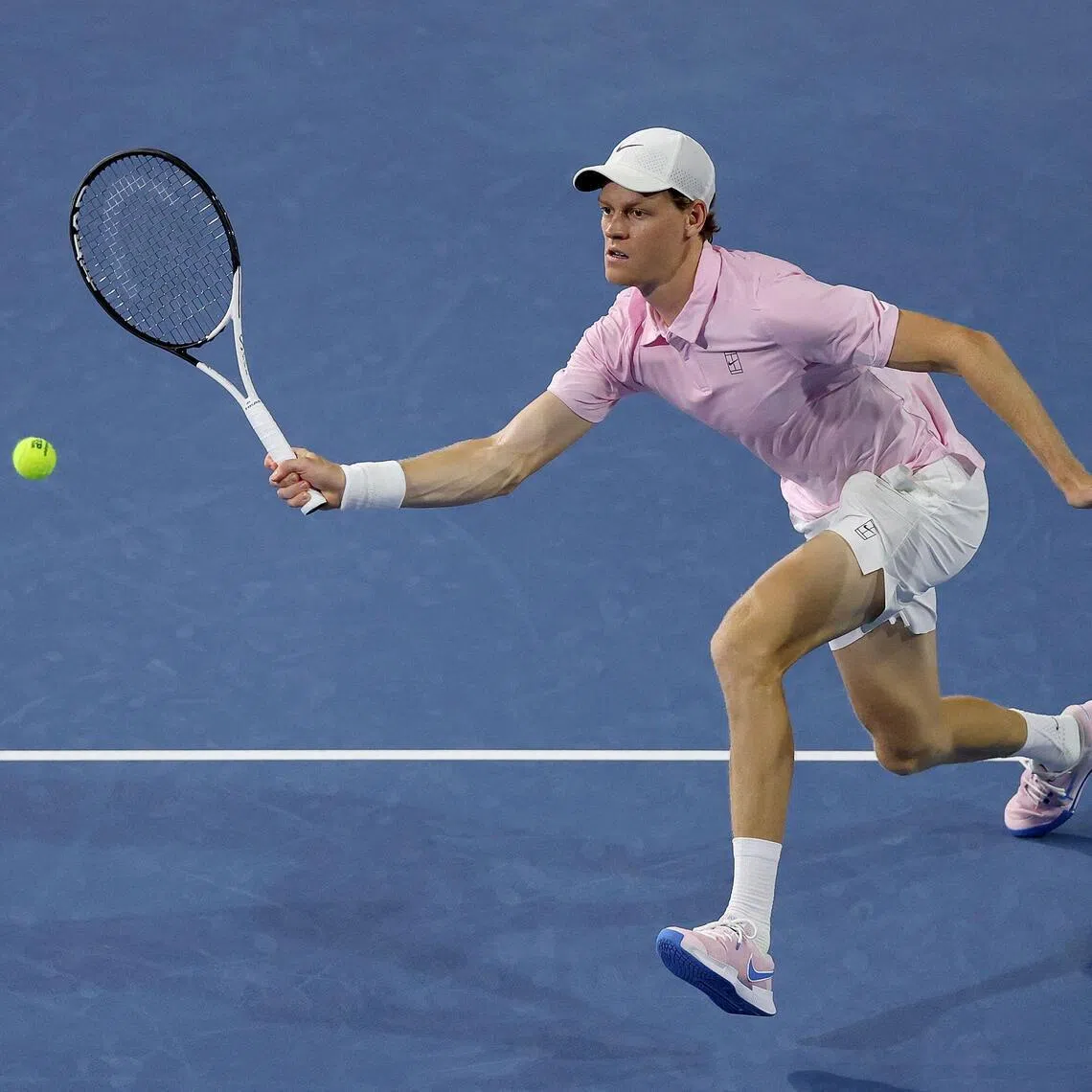 Jannik Sinner of Italy comes to the net against Corentin Moutet of France during their Miami Open clash.