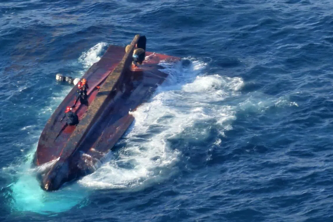 A handout photo made available by the South Korean Coast Guard shows rescue operations under way after a 29-ton fishing vessel capsized in waters off the southern coastal city of Tongyeong, South Korea, on March 9. 