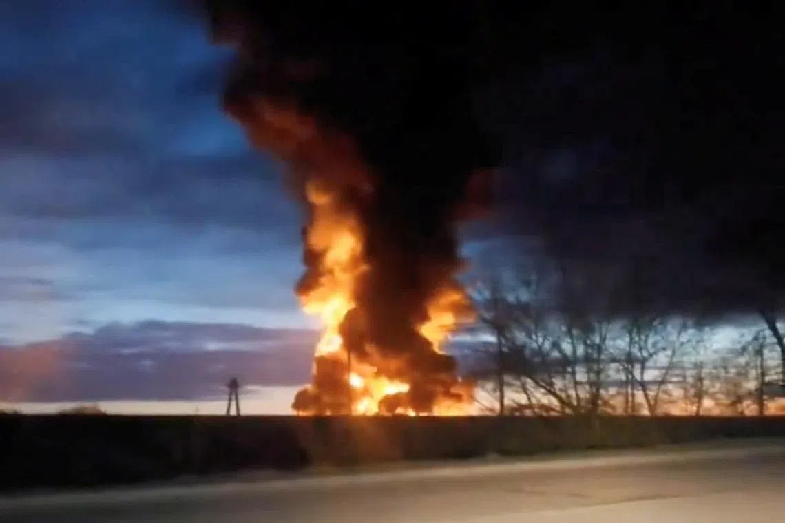 Video taken through a windshield shows a fire at energy facilities after a Ukraine-launched drone attack in Yartsevo, Smolensk region, Russia in this still image from social media video released April 24, 2024, obtained by REUTERS
