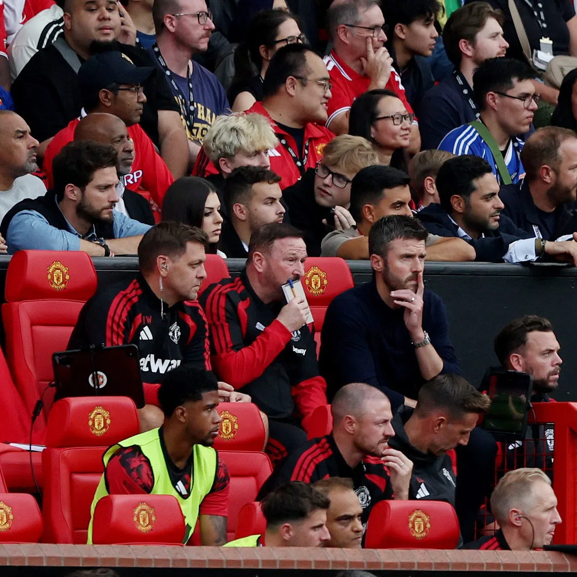 Soccer Football - Premier League - Manchester United v Manchester City - Old Trafford, Manchester, Britain - September 13, 2026 Manchester United manager Michael Carrick with assistant manager Steve Holland and assistant coach Jonathan Woodgate REUTERS/Scott Heppell