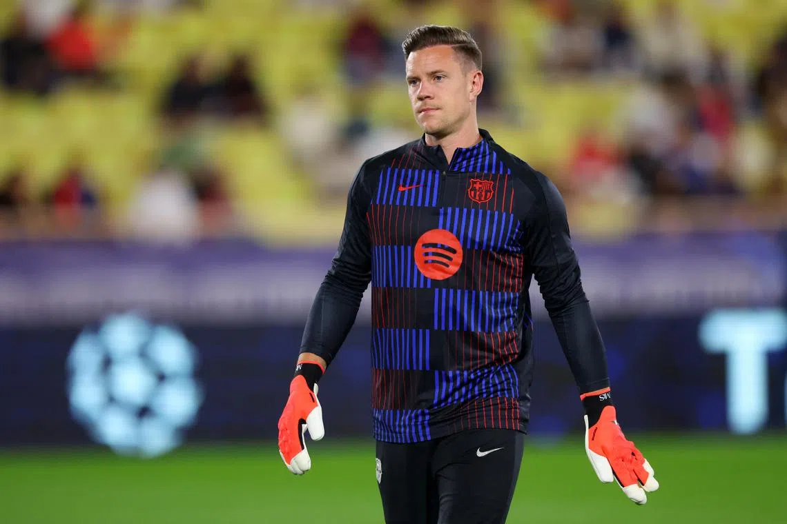 FILE PHOTO: Soccer Football - Champions League - AS Monaco v FC Barcelona - Stade Louis II, Monaco - September 19, 2024 FC Barcelona's Marc-Andre ter Stegen during the warm up before the match REUTERS/Manon Cruz/File Photo