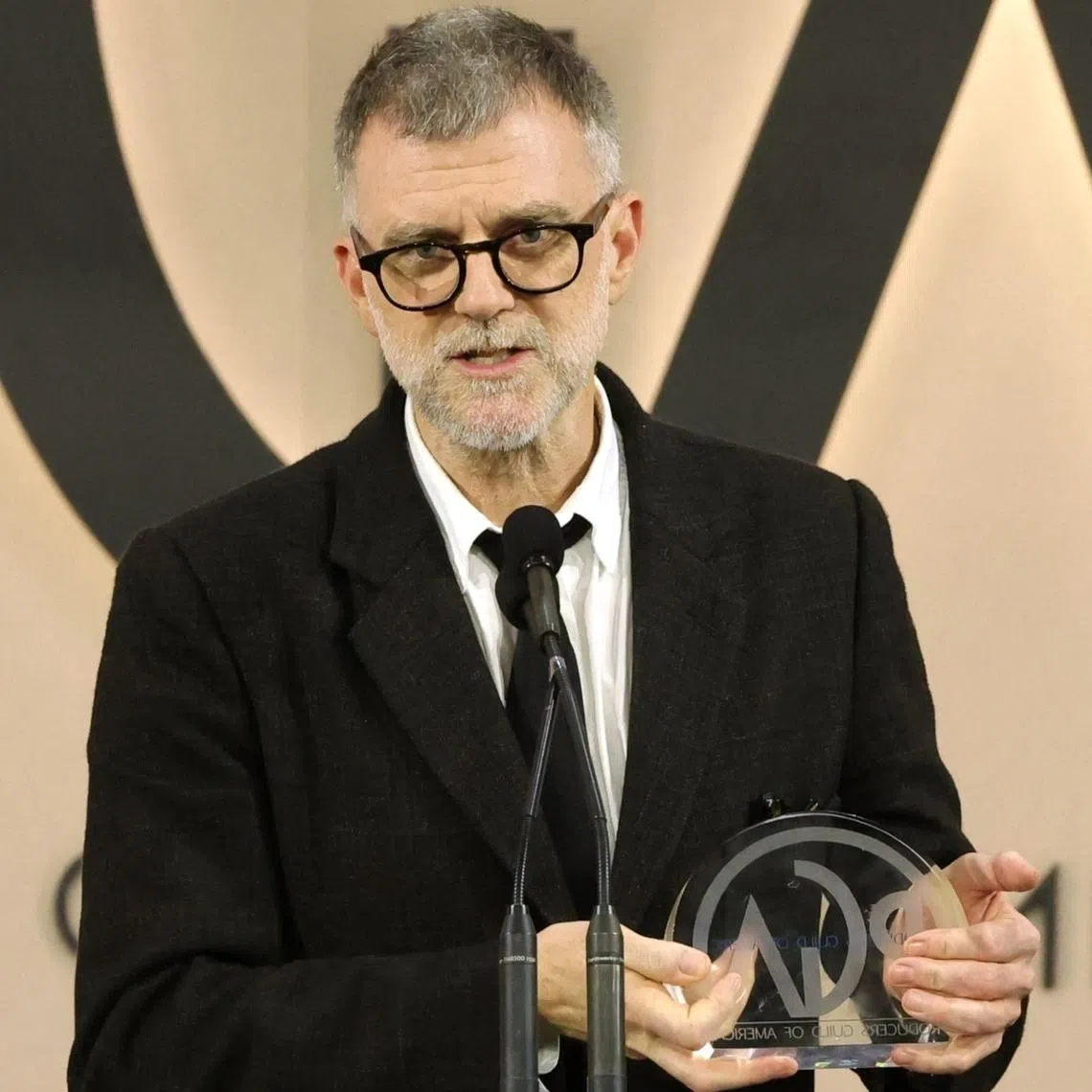 Paul Thomas Anderson accepts the Darryl F. Zanuck Award for Outstanding Producer of Theatrical Motion Pictures for One Battle After Another during the 2026 Producers Guild Awards.