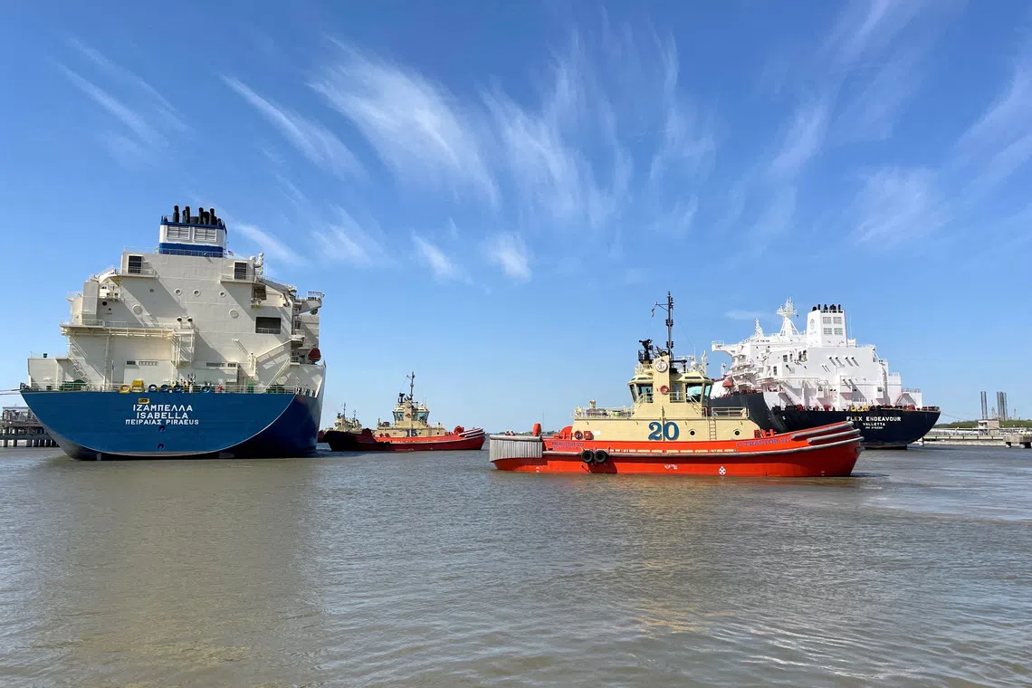 An LNG tanker is guided by tugboats at the Cheniere Sabine Pass LNG export unit in Cameron Parish, Louisiana, the US.