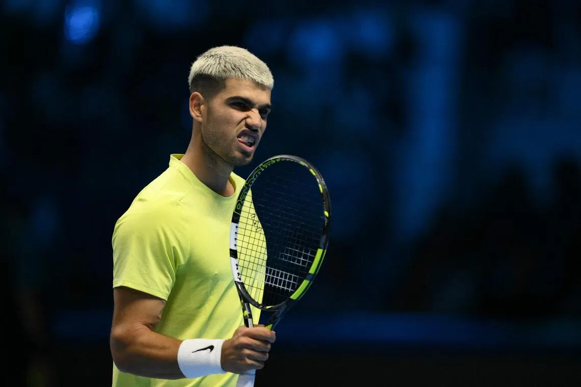 Spain's Carlos Alcaraz reacting during his 7-6 (7-5), 6-2 win over Australia's Alex de Minaur at the ATP Finals tennis tournament in Turin on Nov 9, 2025.