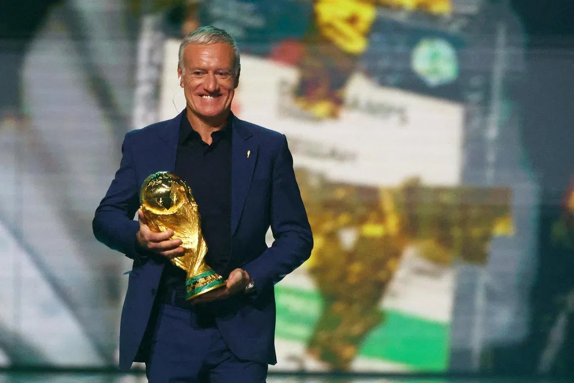 FILE PHOTO: Soccer Football - World Cup - Final Draw - Doha Exhibition & Convention Center, Doha, Qatar - April 1, 2022
France coach Didier Deschamps with the World Cup trophy during the draw REUTERS/Kai Pfaffenbach/File Photo