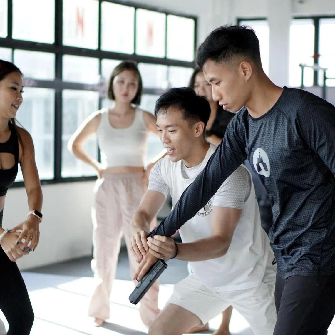 shsandbox19 - Founder of Sandbox Training Ground Peps Goh (centre, in white) says he is mulling closure and bankruptcy of the local stunt school. 
PHOTO: REMUS KOH
