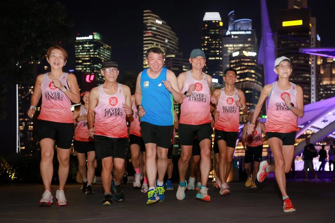 (From left) Ms Jileen Tan, 62, Mr Tan Cheng Kok, 64, Mr Francis Ang Soon Guan, 67, Mr Chan Kok Fu, 60, and 
Ms Chua Suat Har, 62, at a social run around Marina Bay on Aug 27, 2025.