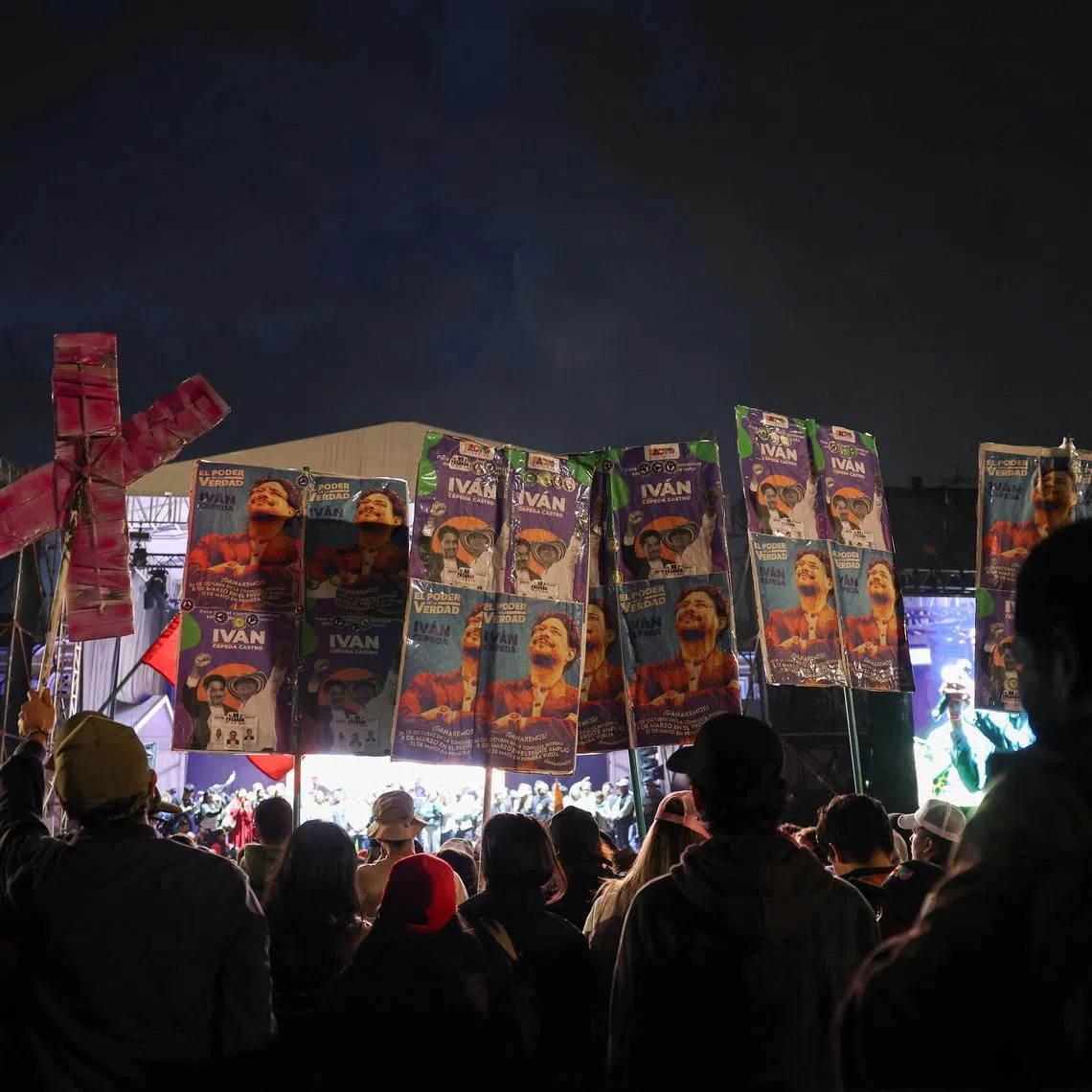 Supporters of Colombian presidential candidate Ivan Cepeda hold campaign posters with his picture as they attend the closing ceremony of the Historic Pact (Pacto Historico) campaign at Plaza de Bolivar in Bogota, Colombia, February 27, 2026. REUTERS/Luisa Gonzalez