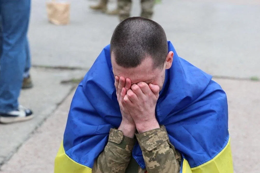 A Ukrainian prisoner of war (POWs) reacts after a swap, amid Russia's attack on Ukraine, at an unknown location in Ukraine, in this handout picture released April 11, 2026. Ukraine's President Volodymyr Zelenskiy via Telegram/Handout via REUTERS
